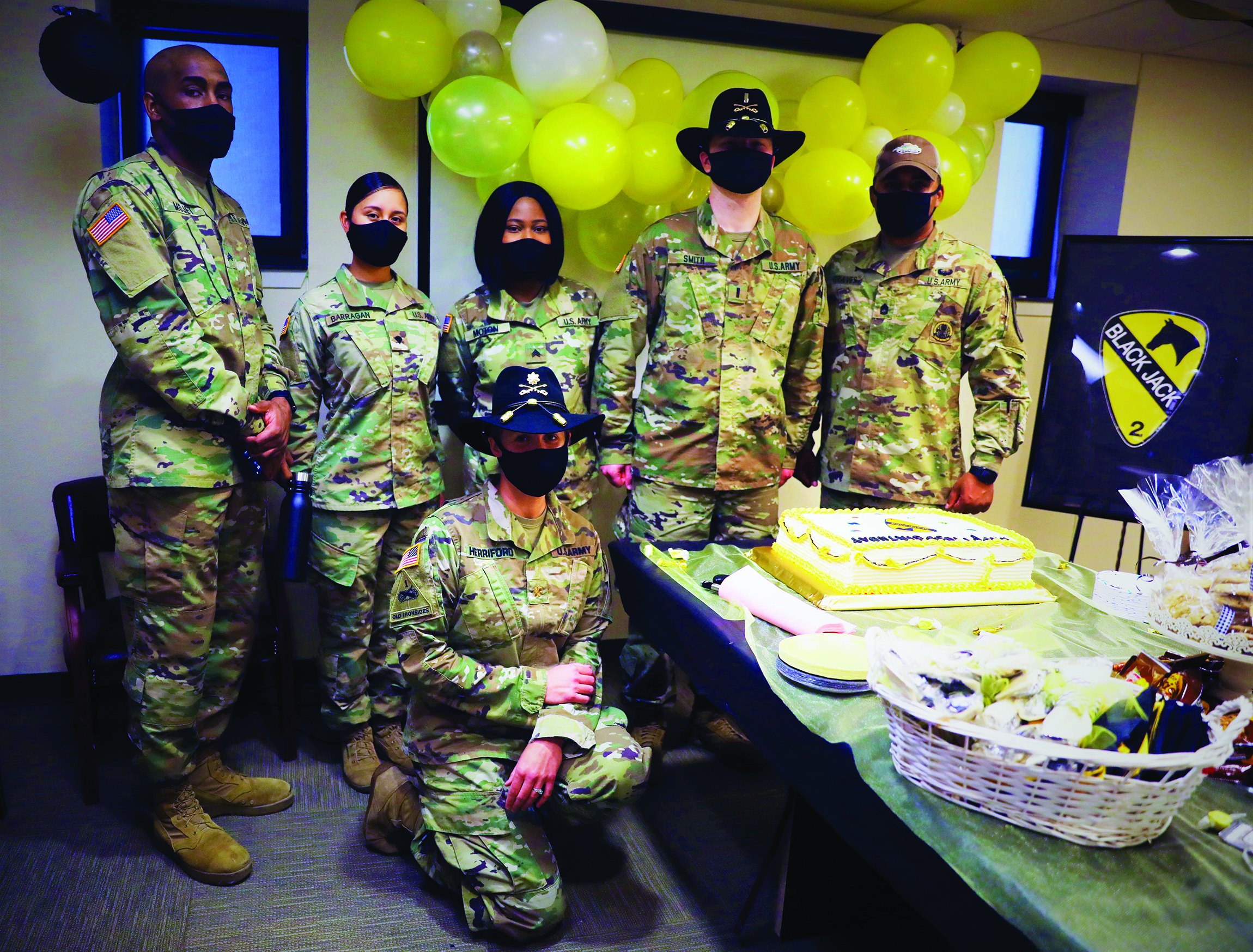 The 2d Armored Brigade Combat Team “Black Jack” celebrated its 103d birthday on 29 August 2020. This birthday bash was more special due to the fact that two of its Soldiers had just won the 1st Calvary Division Paralegal Soldier and NCO Boards. Both SPC Barragan and SGT Moton received a coin from the Brigade CSM and were able to cut the cake. Pictured from left to right: SGT Mojet (Paralegal NCO), SPC Barragan (Paralegal SPC), SGT Moton (Paralegal NCO), 1LT Smith (Admin Law/NSL), SFC Graves (Senior Paralegal NCO); front: MAJ Herriford (Brigade Judge Advocate). 